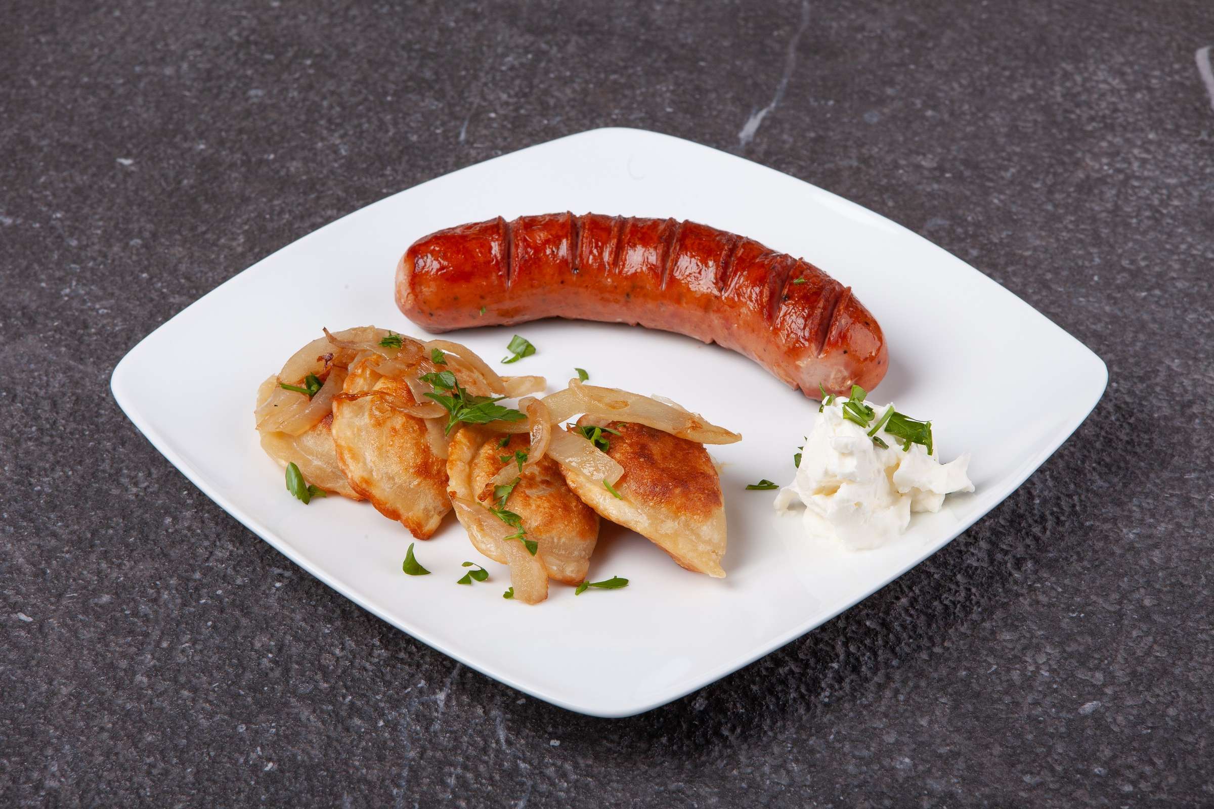 Kielbasa served with pierogies from Pierogies Factory